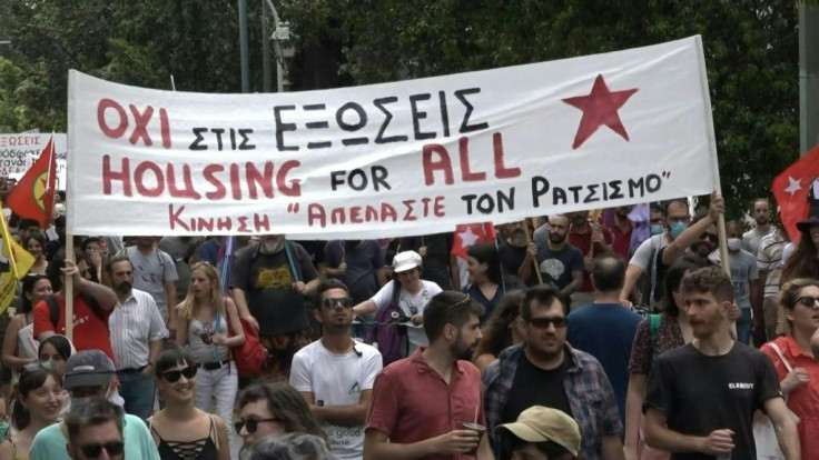Around 2,000 people gather across central Athens to mark World Refugee Day and protest the Greek governmentâs migrant policies. Members of anti-racist groups, joined by refugees from migrant camps, march holding banners and chanting against evictions of