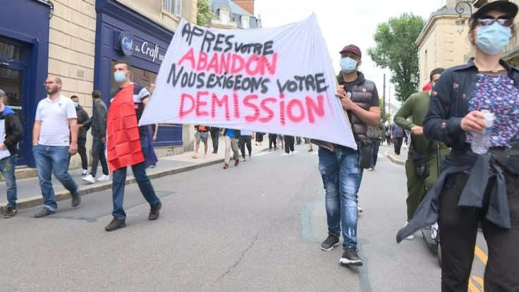 IMAGES Demonstrators in Dijon ask for the resignation of the prefect of the Côte d'Or department, after recent tensions in the city, which began with a punitive expedition by members of the Chechen community against Dijonians of North African origin. Thi