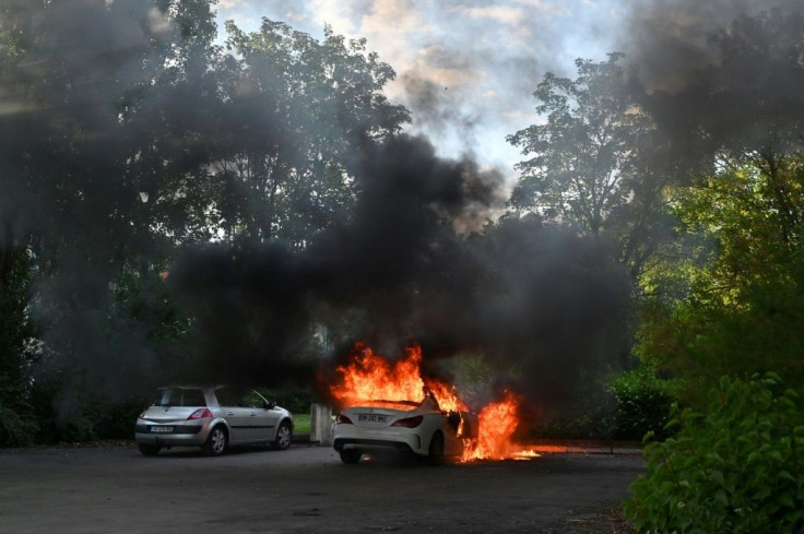 At least 20 people were injured and several cars burned during the unrest