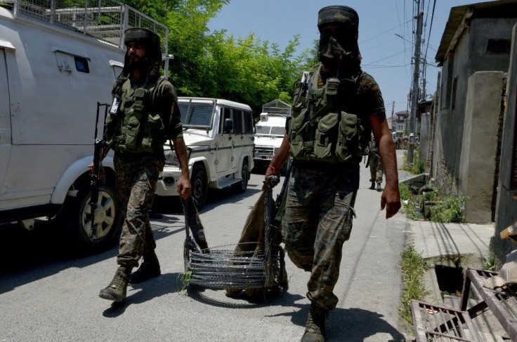 Indian security personnel head to the site of a firefight in the old city of Srinagar, Kashmir, on June 21, 2020
