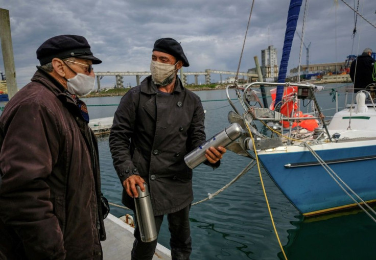 Juan Manuel Ballestero (R), with his father Carlos in Mar del Plata, Argentina, after sailing home from Portugal due to pandemic travel restrictions to see his parents