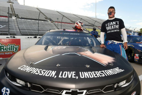 Bubba Wallace, driver of the #43 Richard Petty Motorsports Chevrolet, wears an "I Can't Breathe -- Black Lives Matter" T-shirt under his firesuit at a race in Martinsville, Virginia, in solidarity with protests over the death of George Floyd