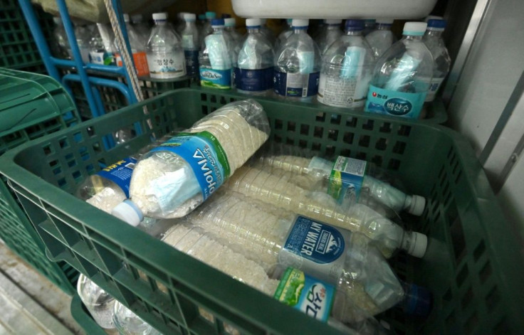 Plastic bottles filled with rice and face masks are pictured on June 18, 2020 in Seoul, loaded on the truck of a North Korean defector planning to send the bottles towards North Korea through a border river