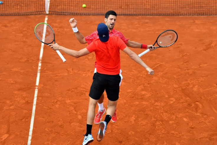 Novak Djokovic chest-bumping  Filip Krajinovic in the Belgrade leg of Adria exhibition tour