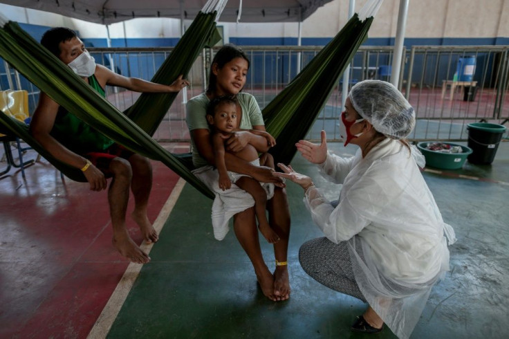 A Warao family receives attention from Doctors Without Borders medics in Manaos, northern Brazil