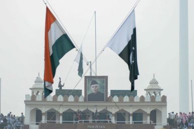 The Indian and Pakistan flags fly during the daily beating of the retreat ceremony at the Wagah Border