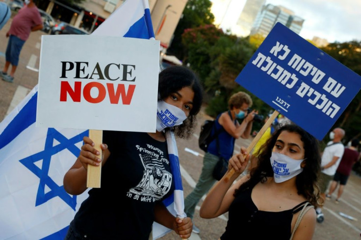 Protesters gather in Tel Aviv's Rabin Square to denounce Israel's plan to annex parts of the occupied West Bank -- the UN Security Council will take up the issue this week