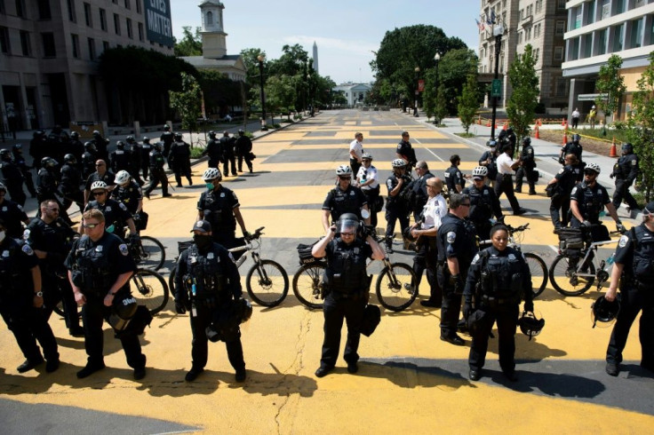 DC Police hold a line after pushing a small group protestors out of Black Lives Matter Plaza near the White House.