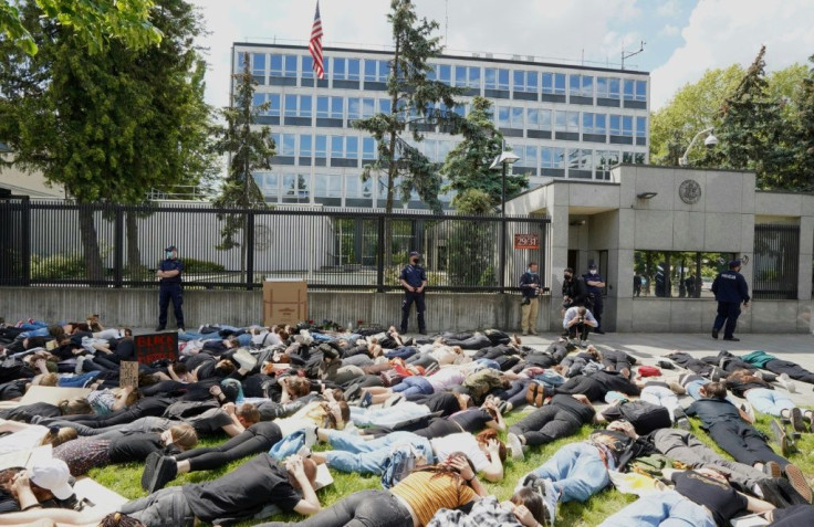 Demonstrators lie down in a June 4 protest against racism outside the US embassy in Warsaw in solidarity with US protests over the death of George Floyd