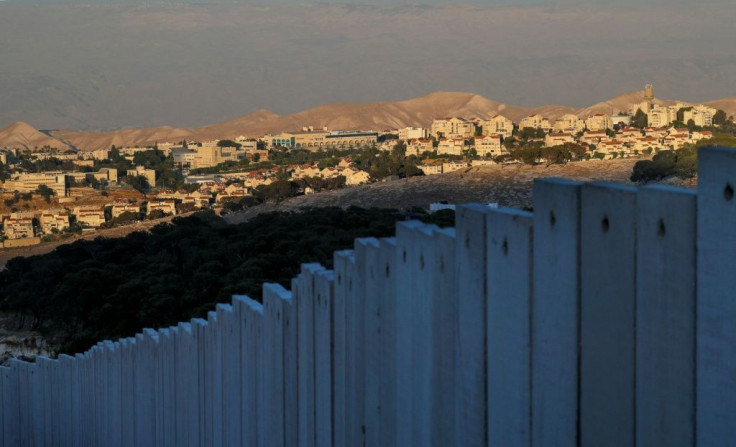 Israel's controversial separation barrier stands before the Israeli settlement of Maale Adumim in the occupied West Bank