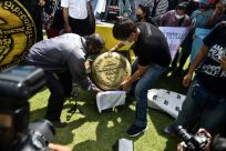Thai activists unveil a replica of bronze plaque marking the anniversary of the 1932 revolution. The original mysteriously vanished in 2017