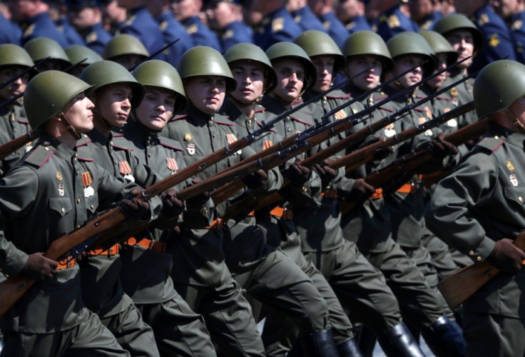 No masks were worn by participants -- and few by spectators -- at a huge parade in Moscow during World War II commemorations