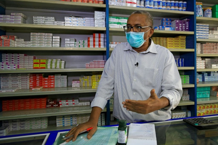 Pharmacy owner Abdulaziz Othman bemoans the acute shortage of medicines at his drugstore in the Sudanese capital Khartoum