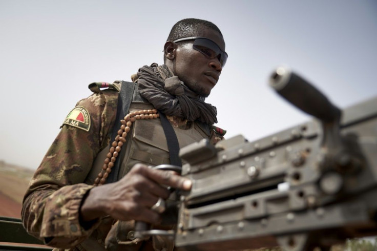 On patrol: A soldier on the perilous highway between Mopti and Djenne in central Mali