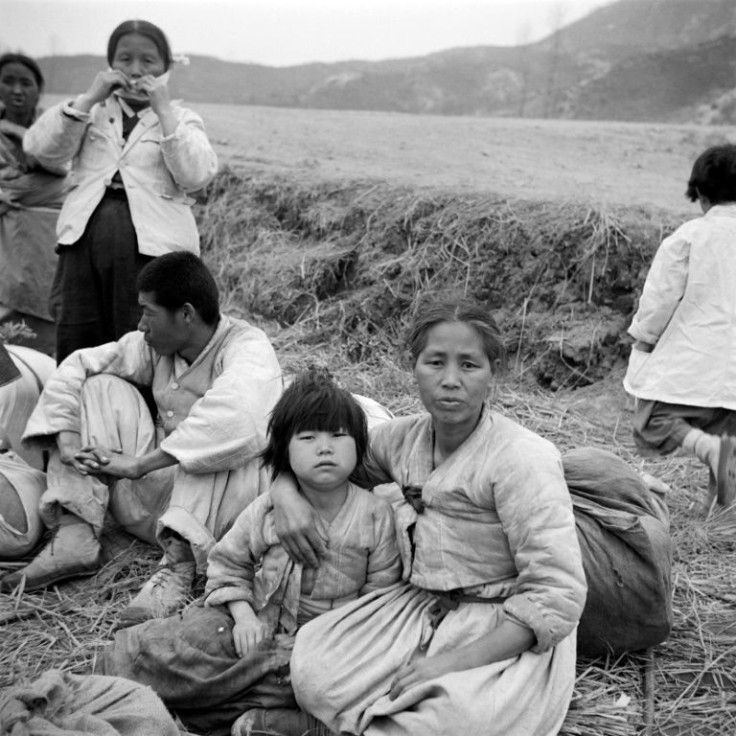 The fighting ended with an armistice that was never replaced by a peace treaty -- here unidentified Korean refugees rest after being forced to flee in 1951