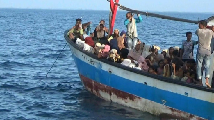 Nearly 100 Rohingya migrants from Myanmar, including 30 children, were rescued from a rickety wooden boat off the coast of Indonesia's Sumatra island on Wednesday. They had gone without food for several days, officials said.