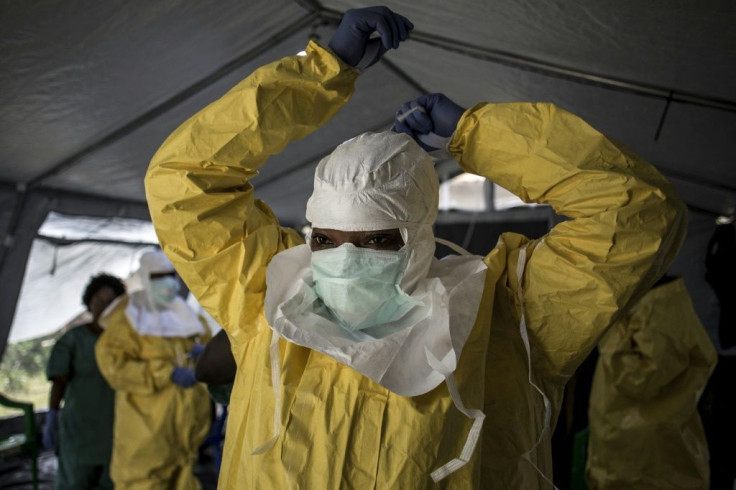 An Ebola worker in DR Congo dons full protective gear against the lethal virus