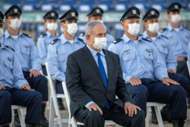 Israeli Prime Minister Benjamin Netanyahu (C) broke the news of an impending collaboration between the Jewish state and the Arab Gulf country to fight the novel coronavirus, following "prolonged and intense contacts"