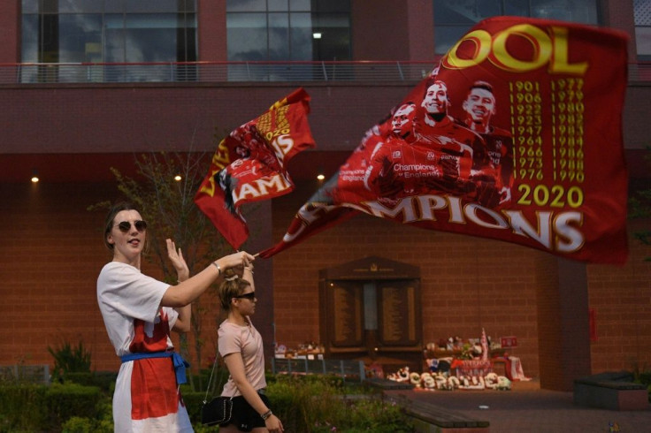 Fans in Liverpool celebrate the Premier League title