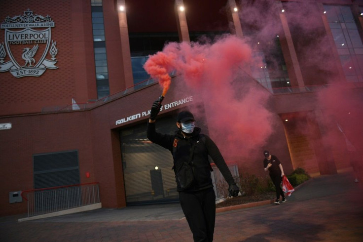 Fans celebrate Liverpool's Premier League title win outside Anfield