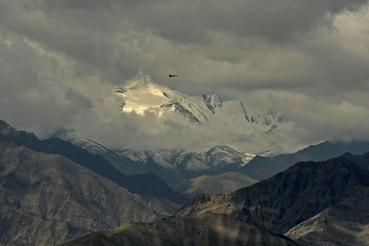 An Indian fighter jet flies over Leh, the joint capital of the union territory of Ladakh, on June 25, 2020, part of a show of strength after a border showdown between Delhi and Beijing