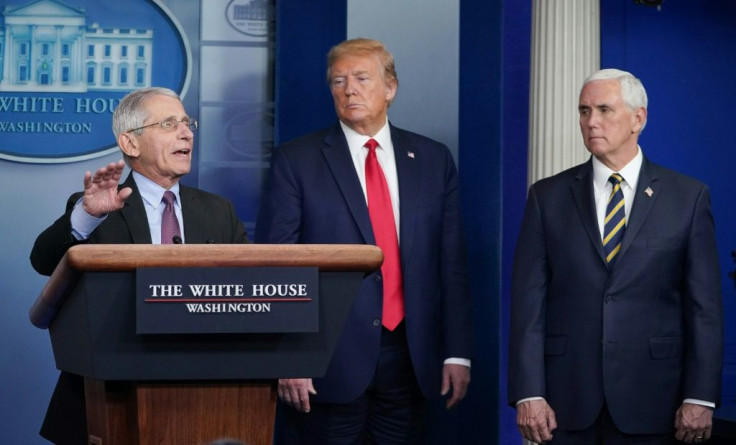 Director of the National Institute of Allergy and Infectious Diseases Anthony Fauci, flanked by US President Donald Trump and US Vice President Mike Pence, speaks during a task force briefing in late April