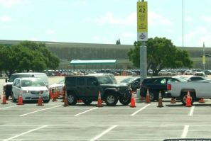 Long line of cars wait at coronavirus drive-through testing site in Miami