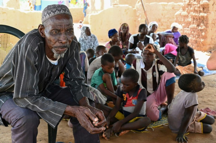 Belem Boureima, a 74-year-old farmer, and his family. They are among the hundreds of thousands of people in Burkina Faso who have fled their homes because jihadist attacks