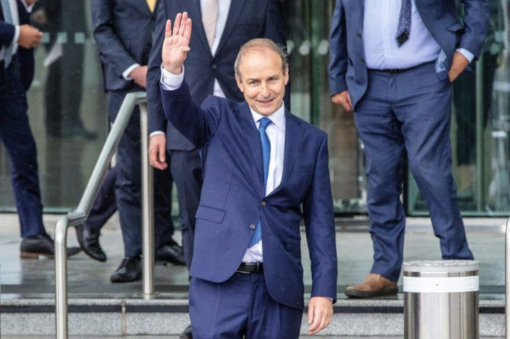 Fianna Fail leader Micheal Martin waves after being elected Ireland's new prime minister