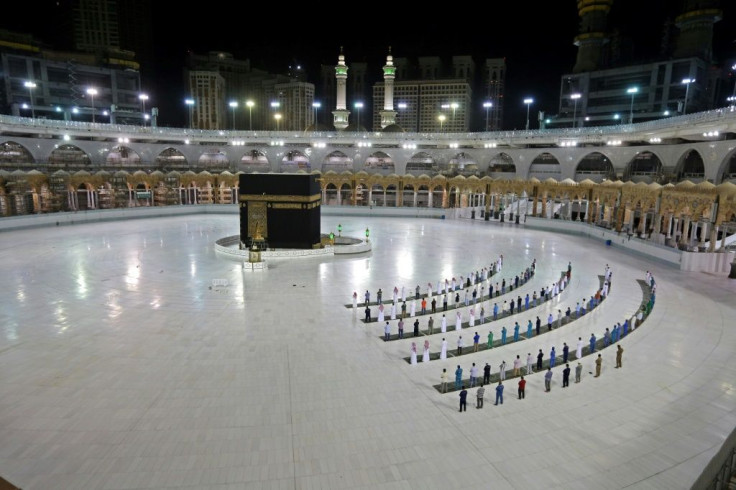 A handful of worshippers pray at the Islam's holiest shrine, the Grand Mosque complex in Saudi Arabia's holy city of Mecca, usually teeming with pilgrims as the annual hajj pilgrimage approaches