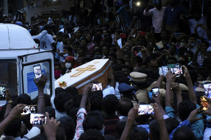 The coffins of J. Jayaraj and Bennicks Immanuel were carried through the crowd in the southern Indian state of Tamil Nadu