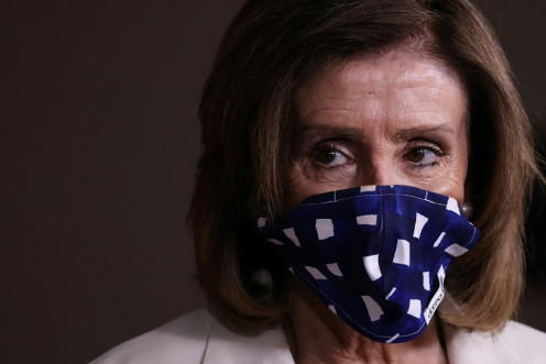 US House speaker Nancy Pelosi, seen wearing a protective mask at a May 7, 2020 briefing, has urged President Donald Trump to set an example by doing the same