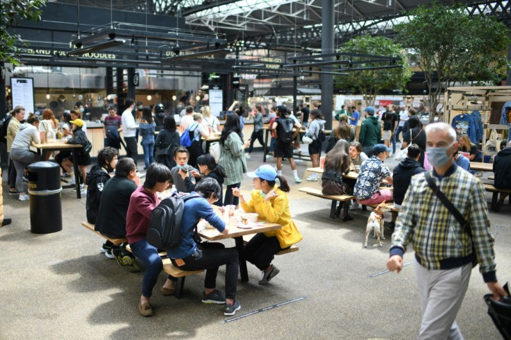 People visit Old Spitalfields Market in London as Britian's Prime Minister Boris Johnson pledges to spend billions on infrastructure to revive the  economy