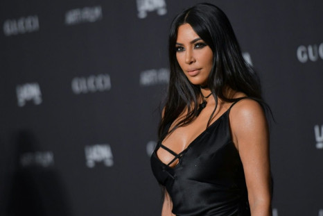 Kim Kardashian West, pictured here in November 2018, has agreed to sell a 20 percent stake in her beauty brand to Coty for $200 million