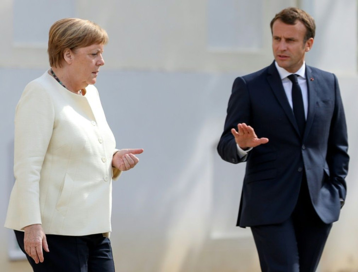 Chancellor Angela Merkel and French President Emmanuel Macron for talks at the German government retreat in Meseberg