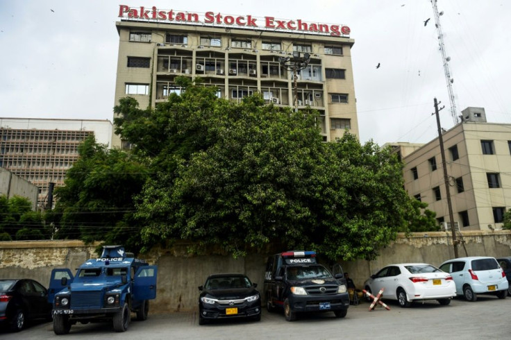 Police vehicles are seen in front of the Pakistan Stock Exchange building following a deadly attack by separatists from Balochistan province