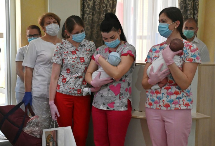 Nurses prepare to hand over babies to foreign couples at a Kiev hotel -- but some people worry a highly profitable and murky business is taking advantage of desperate young women and operating in a grey zone open to abuse