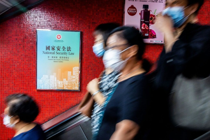 A government advertisement (L) promoting Chinaâs national security law is displayed inside an MTR train station in Hong Kong