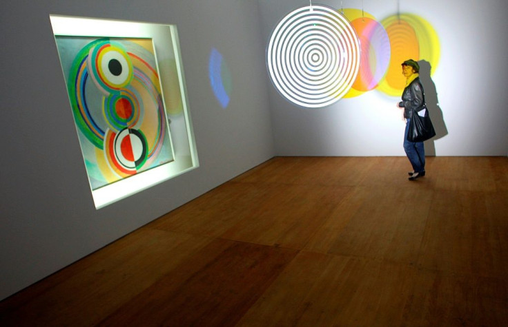 Painting, "Rythme" (L) by French artist Sonia Delaunay is displayed next to a piece (C) entitled "Your Concentric Welcome" by Olafur Eliasso in Chaumont, eastern France