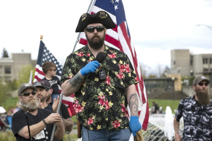 The "Boogaloo" movement (supporters pictured April 2020 in Olympia, Washington), which has adopted Hawaiian shirts as a uniform, promotes "a coming civil war and/or collapse of society"