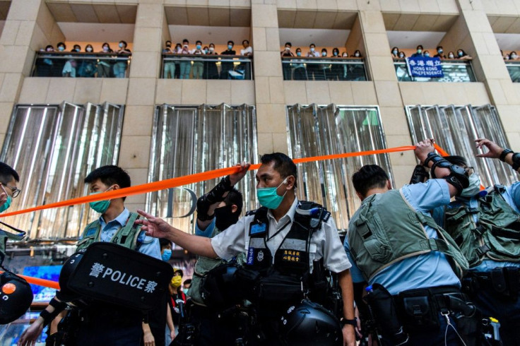 Police enter a shopping mall to disperse people attending a lunchtime rally in Hong Kong, on the day China passed a sweeping national security law for the city