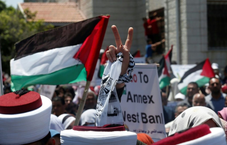 A Palestinian demonstrator in Gaza City flashes the victory sign in a "Day of Rage" to protest Israel's plan to annex parts of the occupied West Bank