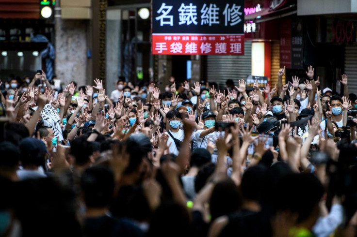 Protesters chant slogans  during a rally against a new national security law in Hong Kong on the anniversary of the city's handover from Britain