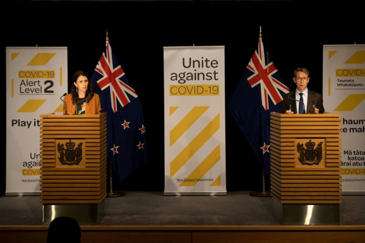 Prime Minister Jacinda Ardern (L) said the minister's presence had become a distraction. He had also been accused of blaming top health official Ashley Bloomfield (R)