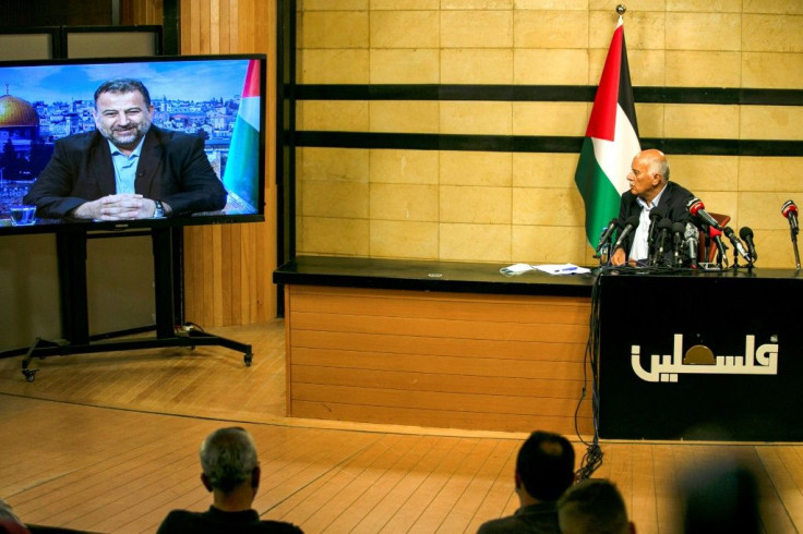 Senior Fatah official Jibril Rajoub, in the West Bank city of Ramallah, attends a rare conference by video-link with deputy Hamas chief Saleh Arouri (on screen from Beirut) to discuss Israel's plan to annex parts of the occupied West Bank