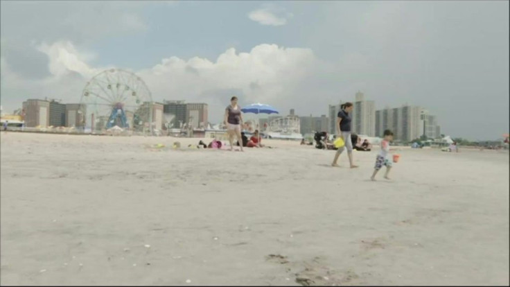 New Yorkers enjoy a dip in the sea at Coney Island as the city reopens its beaches to swimmers. Once at the epicenter of the coronavirus pandemic, New York City is gradually reopening, despite a surge of new virus cases in other US states.