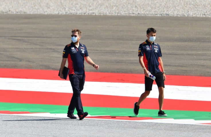 Track and trace: Red Bull's Thai driver Alex Albon (right) inspects the circuit on Thursday
