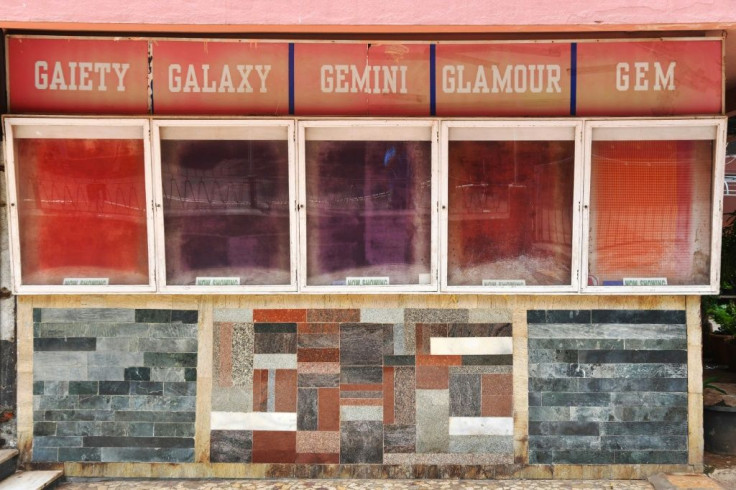 A cinema poster display stands empty during India's coronavirus lockdown
