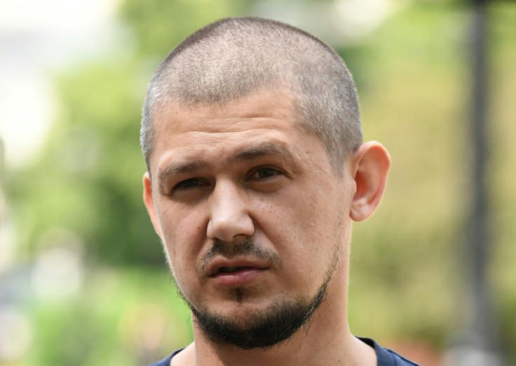 Former neighbourhood police inspector Georgy Zarya amarched to the Moscow police headquarters in May holding a sign urging the city's police chief to resign