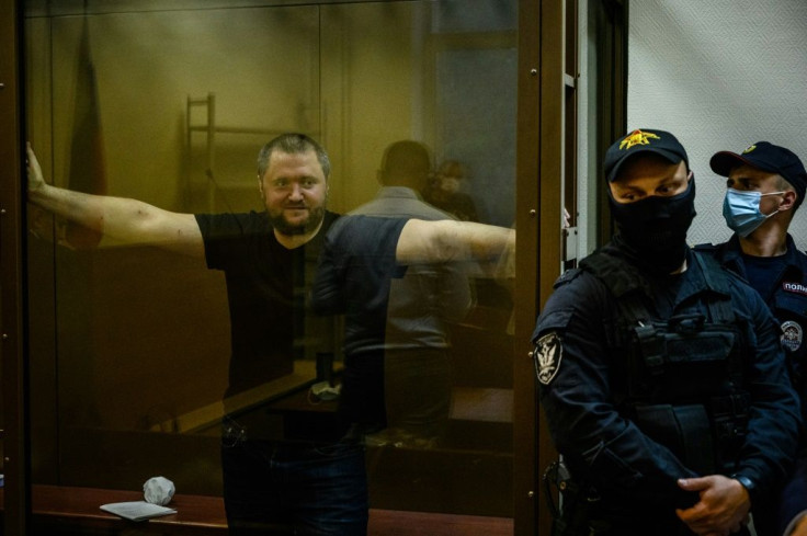 Vladimir Vorontsov, inside a defendant's cage during a court hearing in Moscow on Thursday